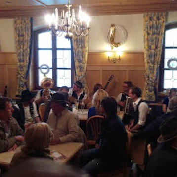 Musicians play in a crowded pub in Regen, Germany
